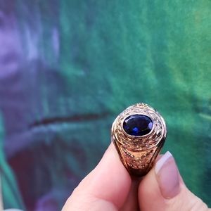 Men's fashion ring with blue stone.